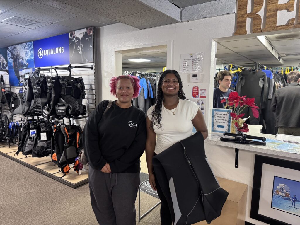 Two students at a scuba dive shop — Black Tech Link BIPOC Coastal Research Program (BCRP)