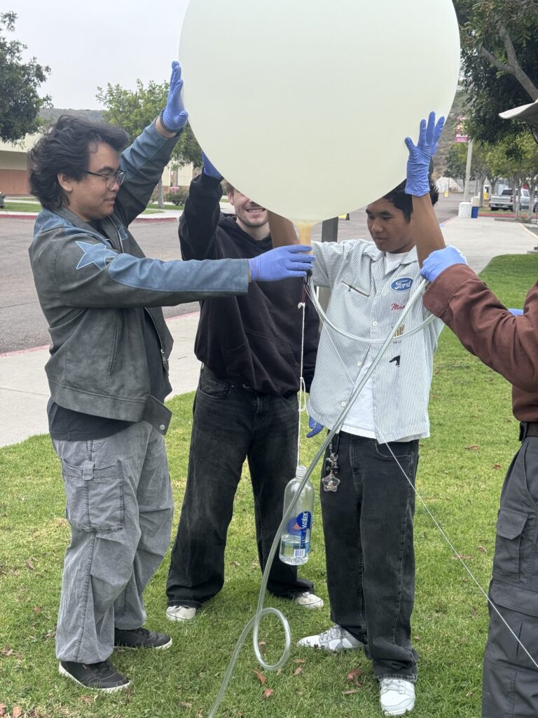 Students holding up a weather balloon — Black Tech Link BIPOC Coastal Research Program (BCRP)