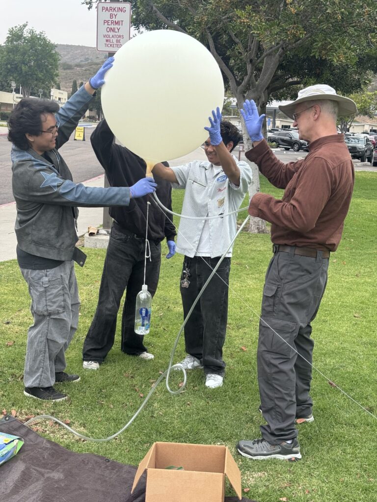 Students launching a weather balloon — Black Tech Link BIPOC Coastal Research Program (BCRP)
